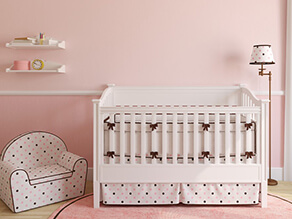 Pretty_in_Pink_Nursery_White_Cot_Ribbons_Polka_Dot_Chair_White_Shelves_timber_Lamp_Fluffy_Rug